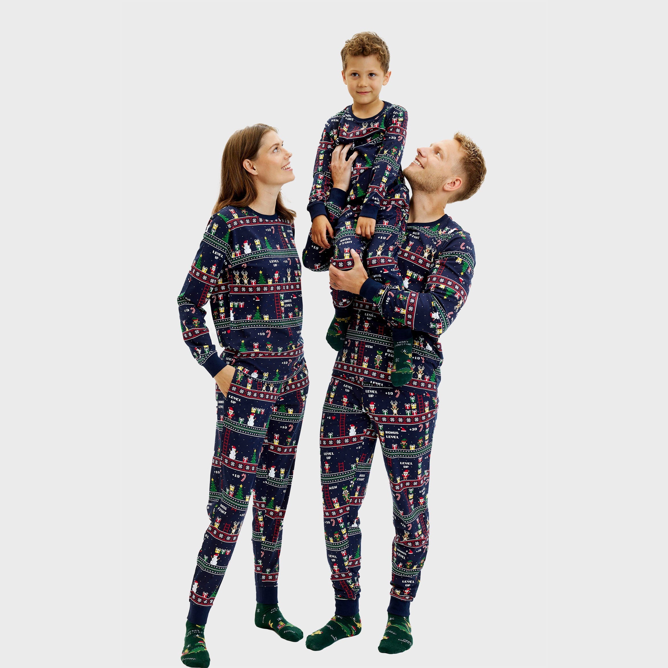 Dunkelblauer Vintage Weihnachtspyjama Herren, Damen und Kinder mit buntem Gamer-Motiv.